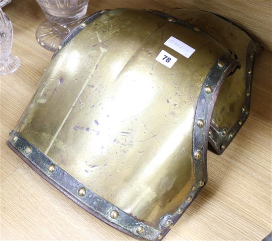 A pair of Victorian brass and iron armour chest plates